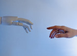 A person reaching out to a robot, imitating Michelangelo's Fresco painting 'Creazione di Adamo' | Image Courtesy: Tara Winstead, Pexels