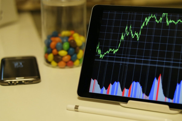 Analytics window on an iPad. A mobile phone by the side.