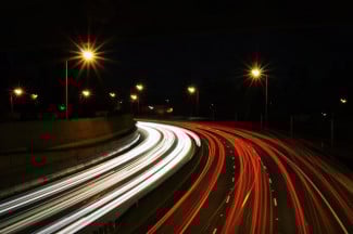Busy freeway traffic at night. Credit: Jake Givens, Unsplash