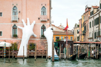 Support by Lorenzo Quinn in Venice, Italy. Credit: Hans M