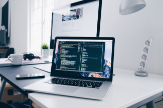 code splash in a laptop. photo by Christopher Gower