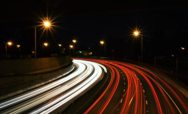 Busy freeway traffic at night. Credit: Jake Givens, Unsplash